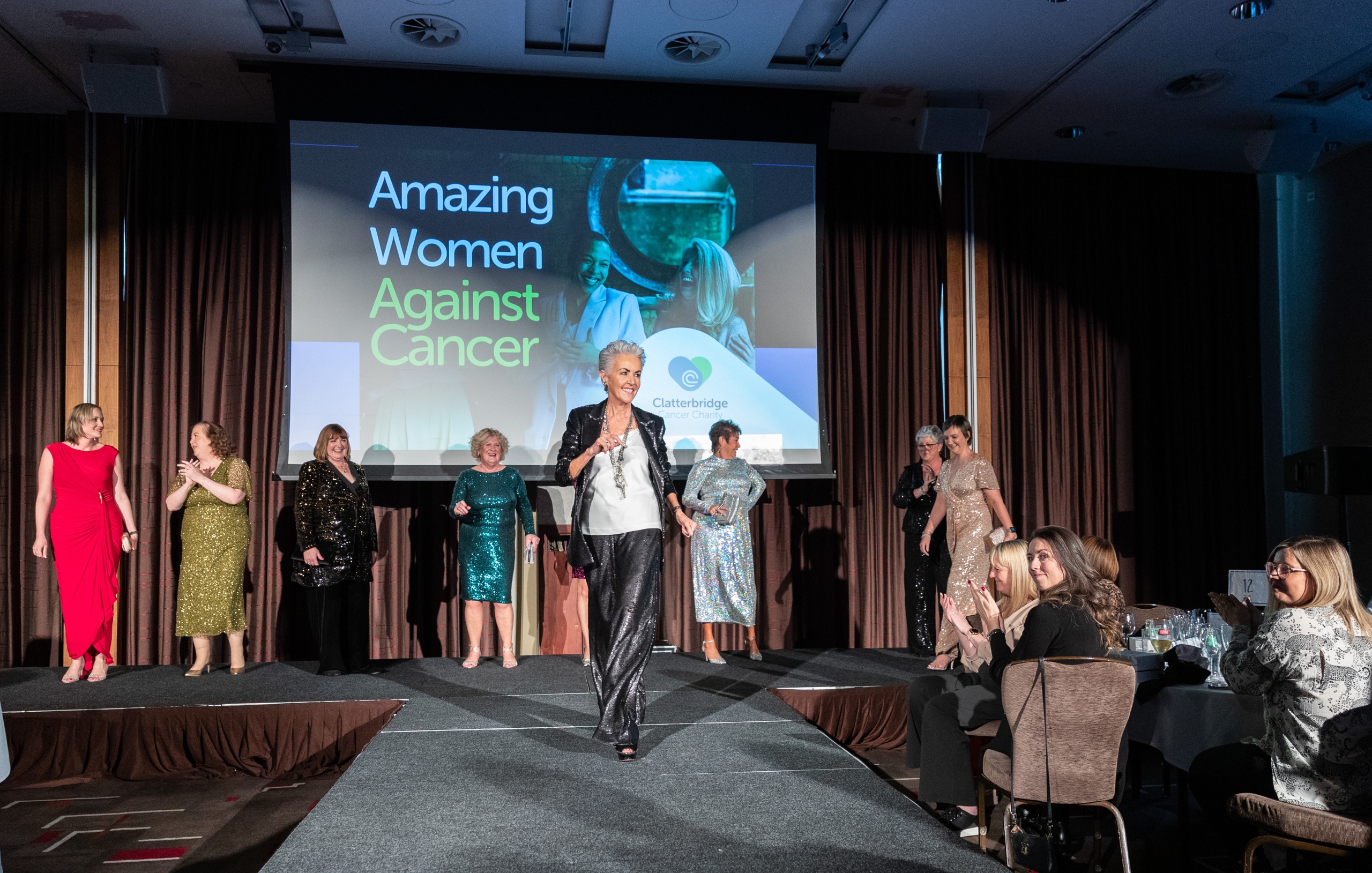 Women on the catwalk at the Charity's amazing women against cancer event in November 2022