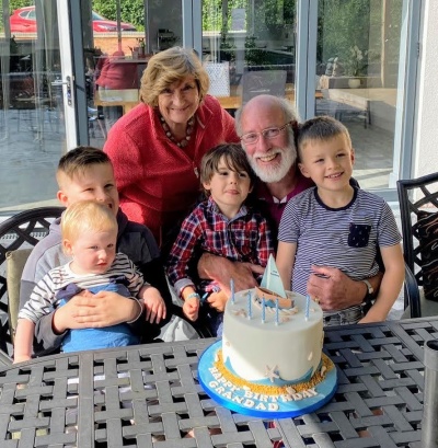 Mike Chapman with wife Jo and their four grandchildren at Mike's 69th birthday.jpg
