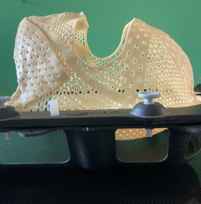 The mask is made from a soft plastic. It has perforations like a mesh so you can breathe through it during treatment.