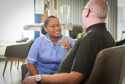staff member and patient in chemotherapy clinic