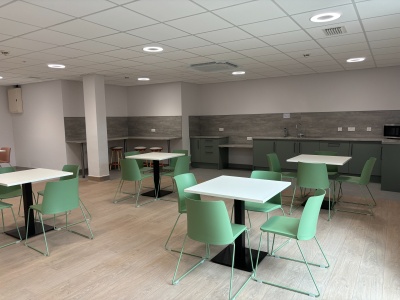 Chairs and tables in the new Staff Lounge, as well as a kitchen area