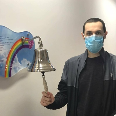 Adam ringing the bell at the end of his treatment.